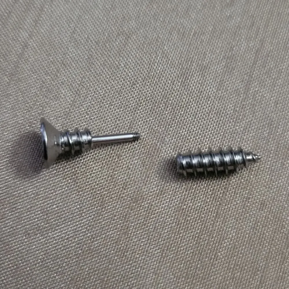 Silver screw shaped illusion post earrings